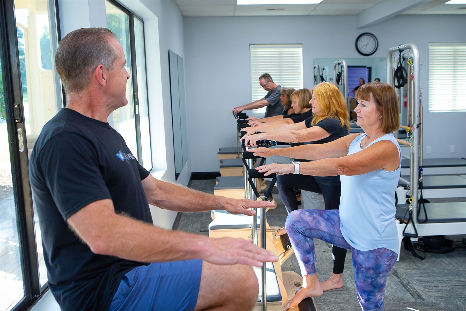 Chris Parks leading a Pilates chair class at Parks Pilates