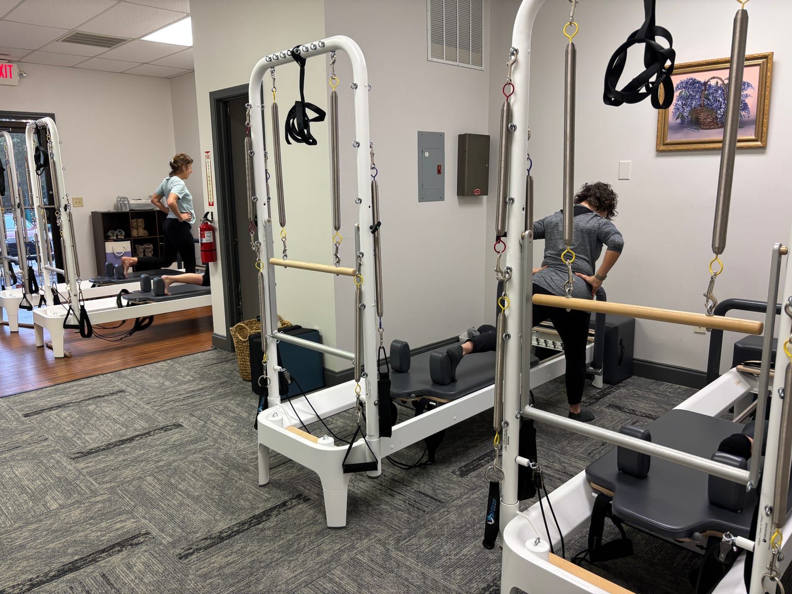 Man training on a Pilates reformer at Parks Pilates
