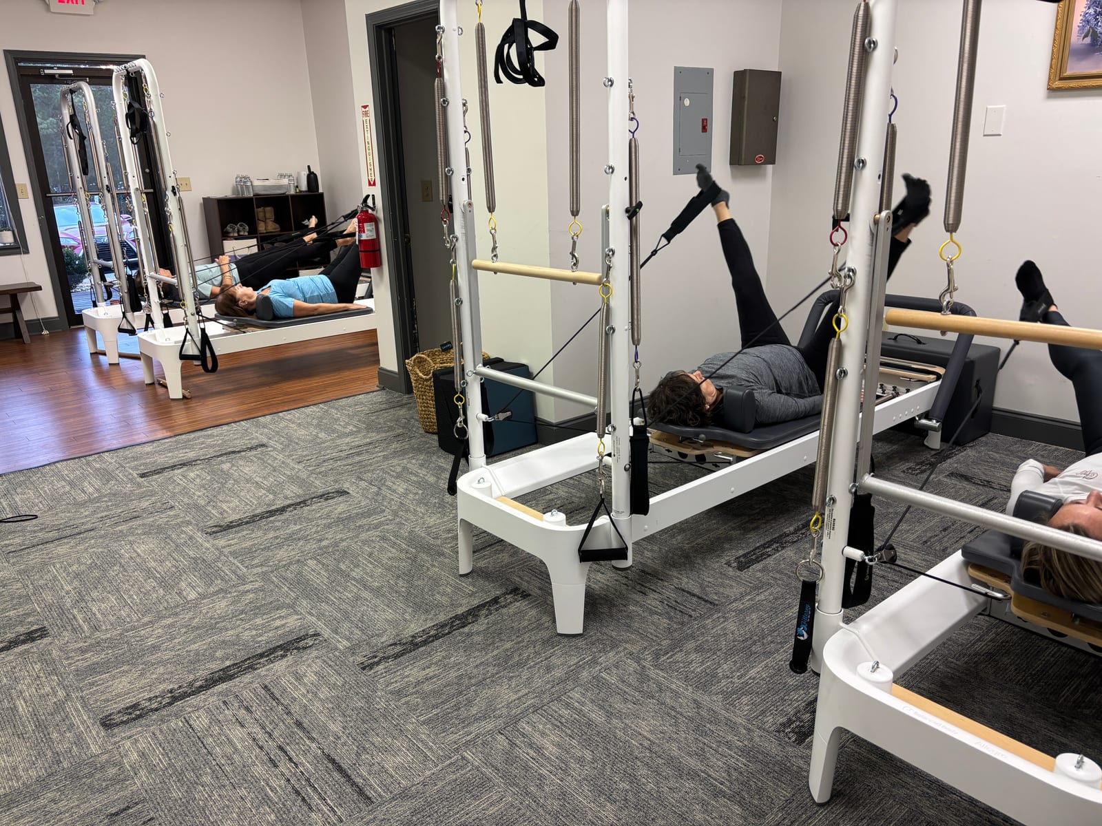 Women in a reformer Pilates class at Parks Pilates